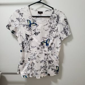 Jaanuu Peplum scrub top